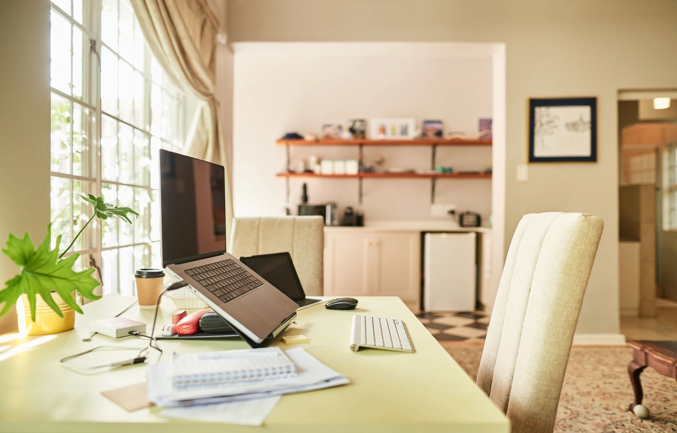 Editorial workspace with books and digital tools